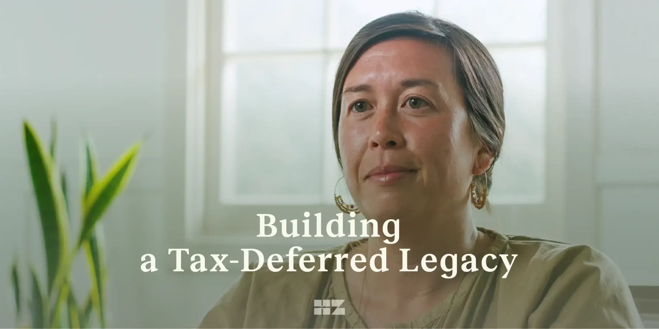 text overlay: building a tax-deferred legacy. over an image of woman real estate professional close up headshot interview